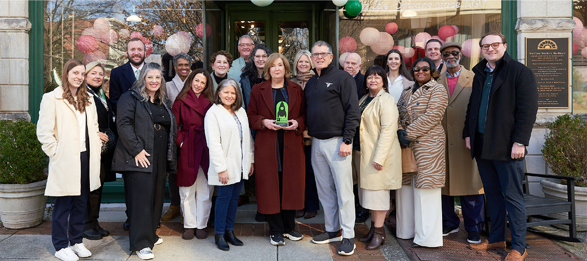 Ron Poteat and the Downtown Huntsville, Inc. Board of Directors present the Best Retail Establishment of 2026 award to the Historic Huntsville Foundation Board of Directors and staff.